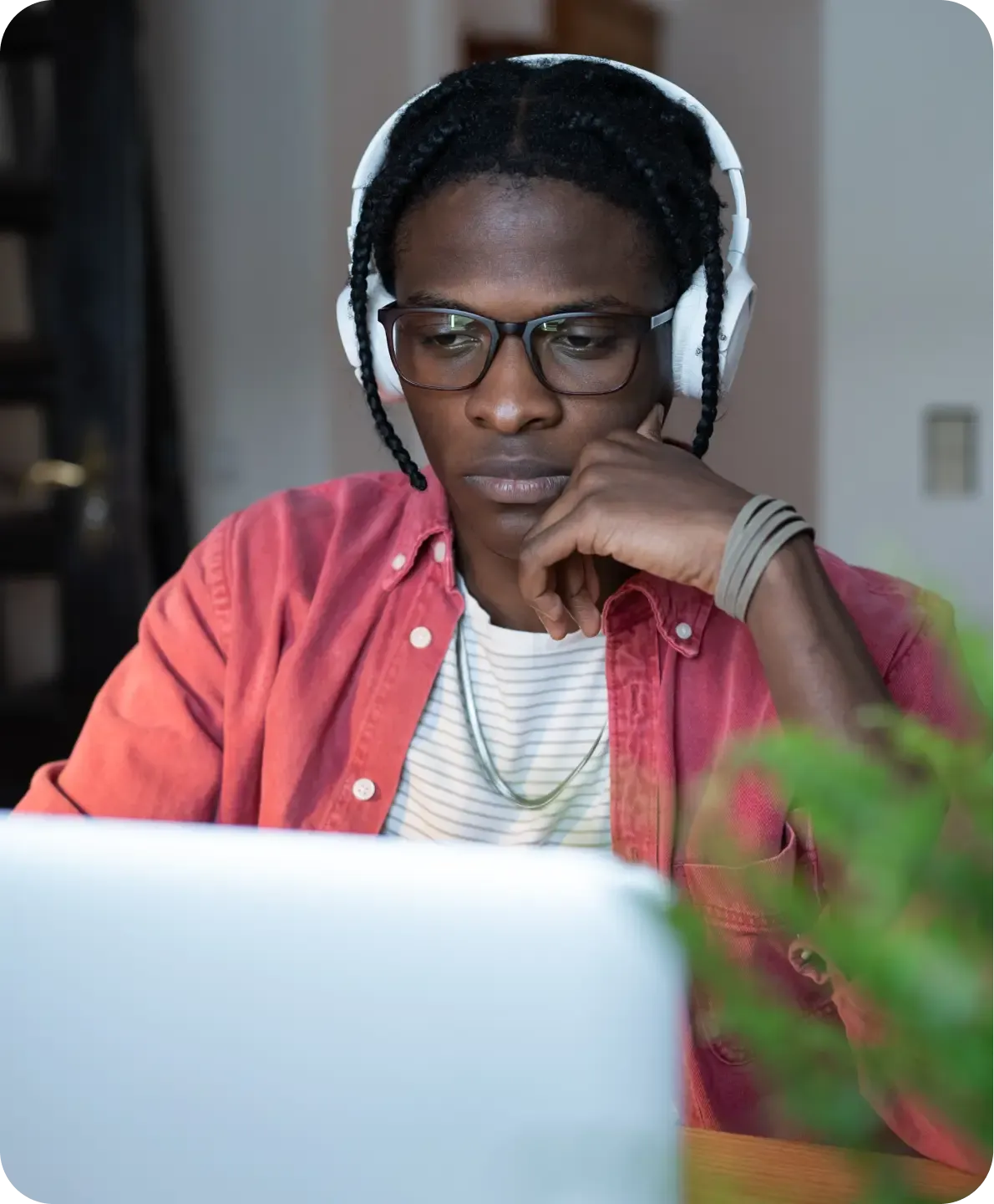 Developer working with Hubtel's APIs at a laptop